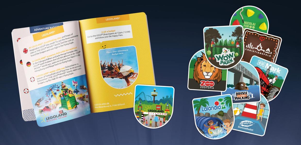 Be Happy Pass er slået op på LEGOLANDs side. 9 farvestrålende badges ligger ved siden af. Klar til at blive klistret ind i passet.